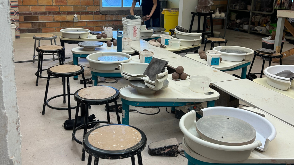 Pottery wheels being set up before pottery class